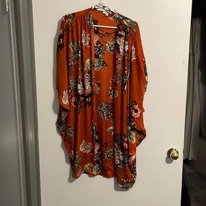 Shrug rust with multi color flowers.